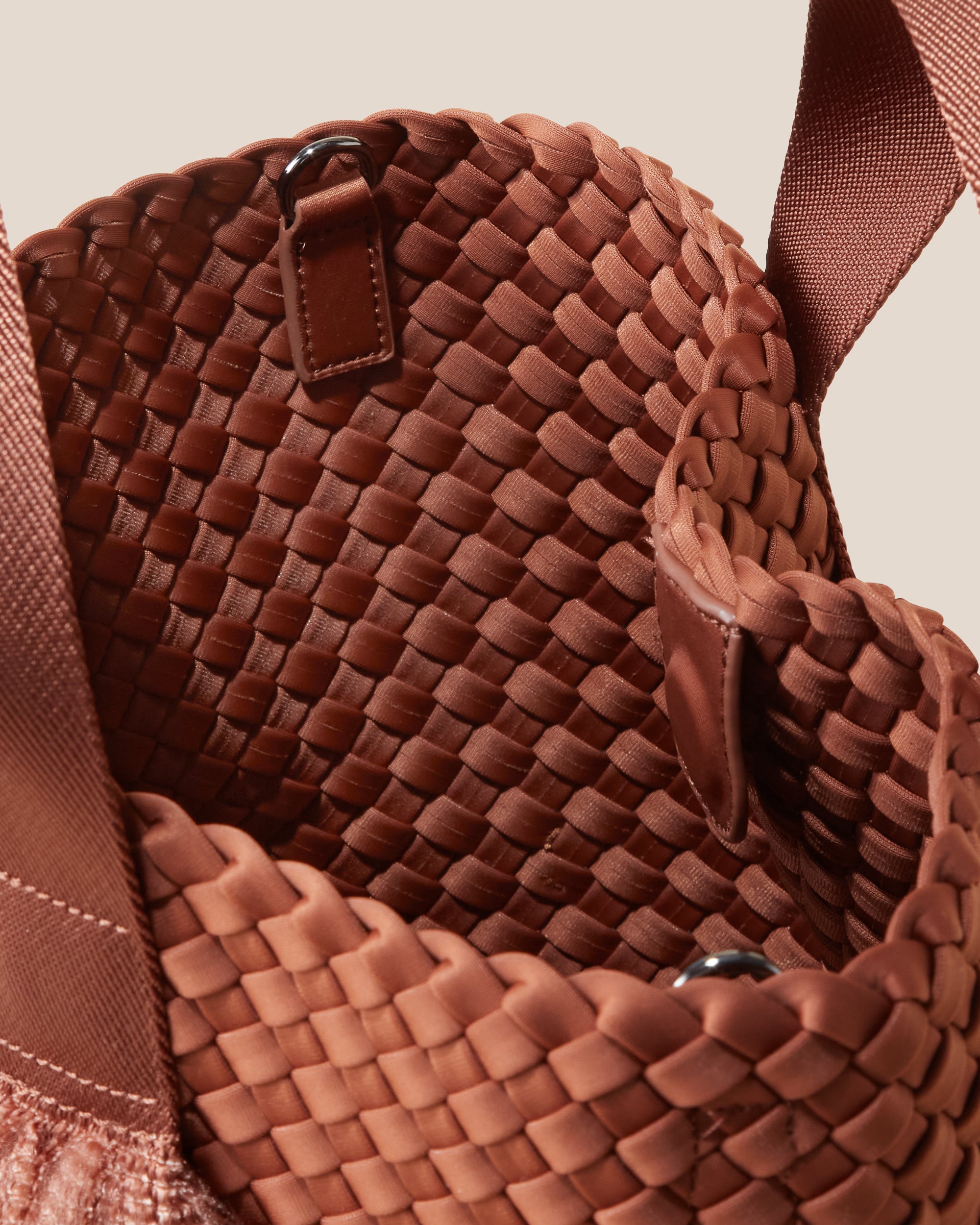 Interior close-up of Tulum Tote in Adobe showing its open top with magnetic snap closure, and unlined interior.