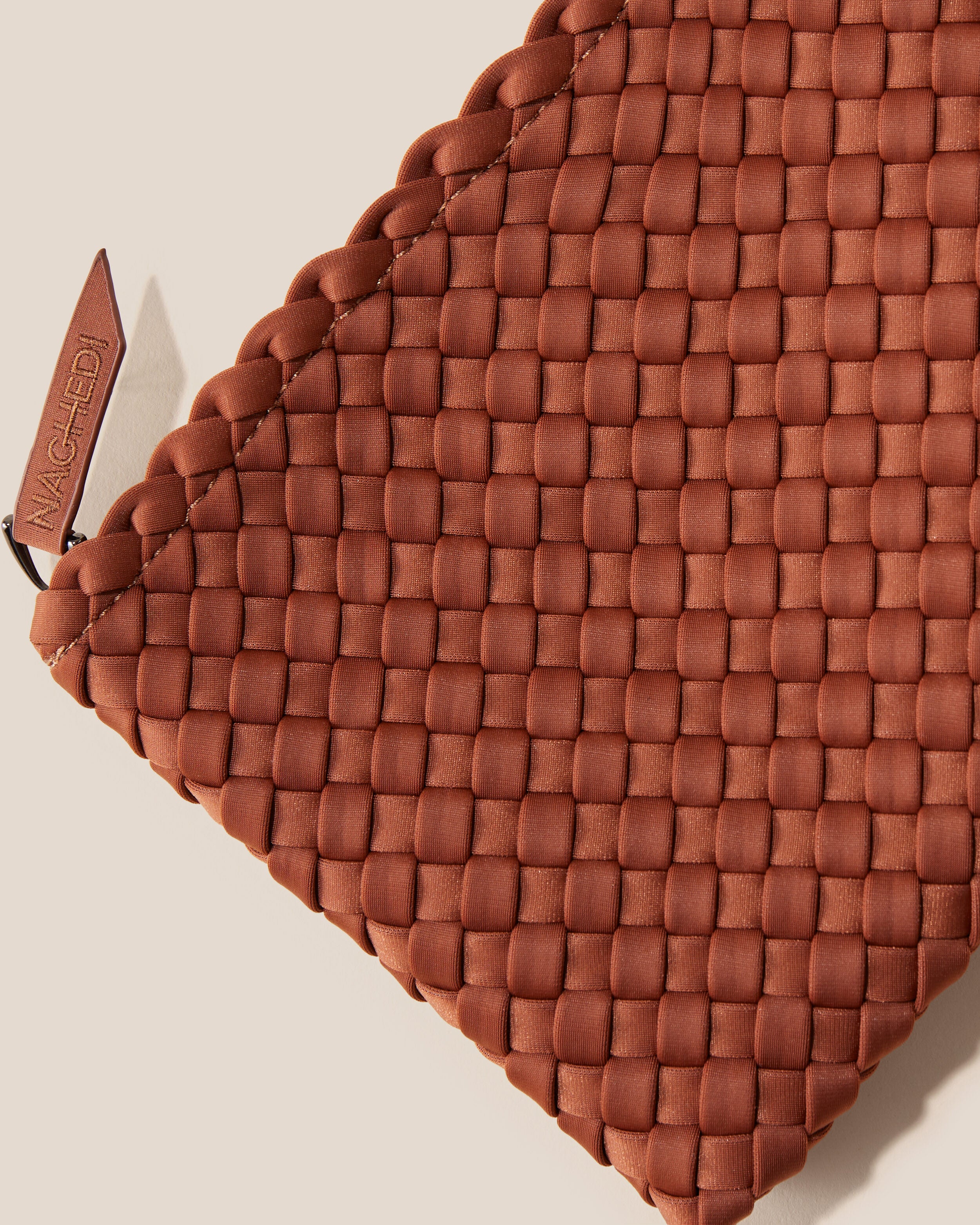 Close-up of included matching woven neoprene zippered pouch.