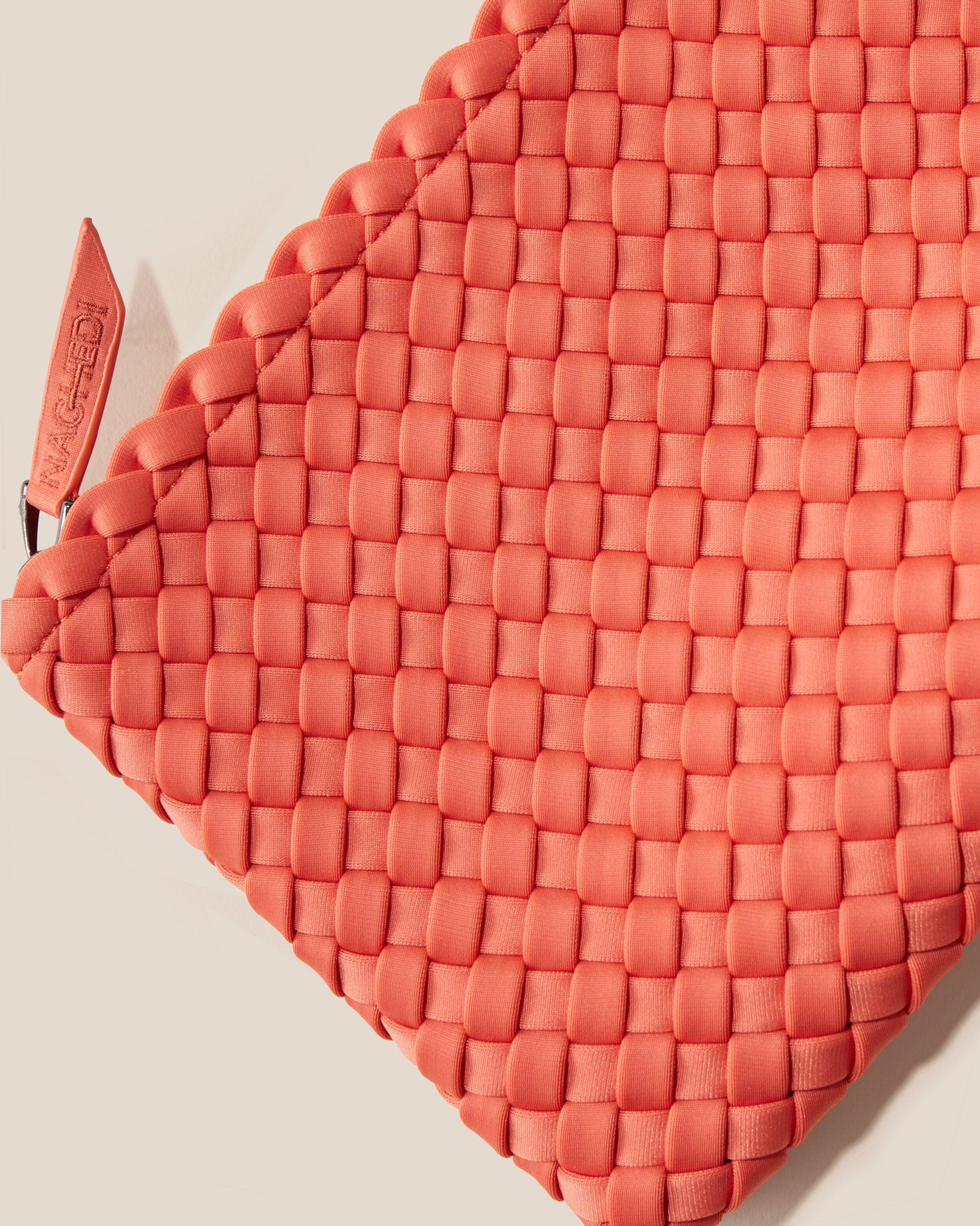 Close-up of included matching woven neoprene zippered pouch.
