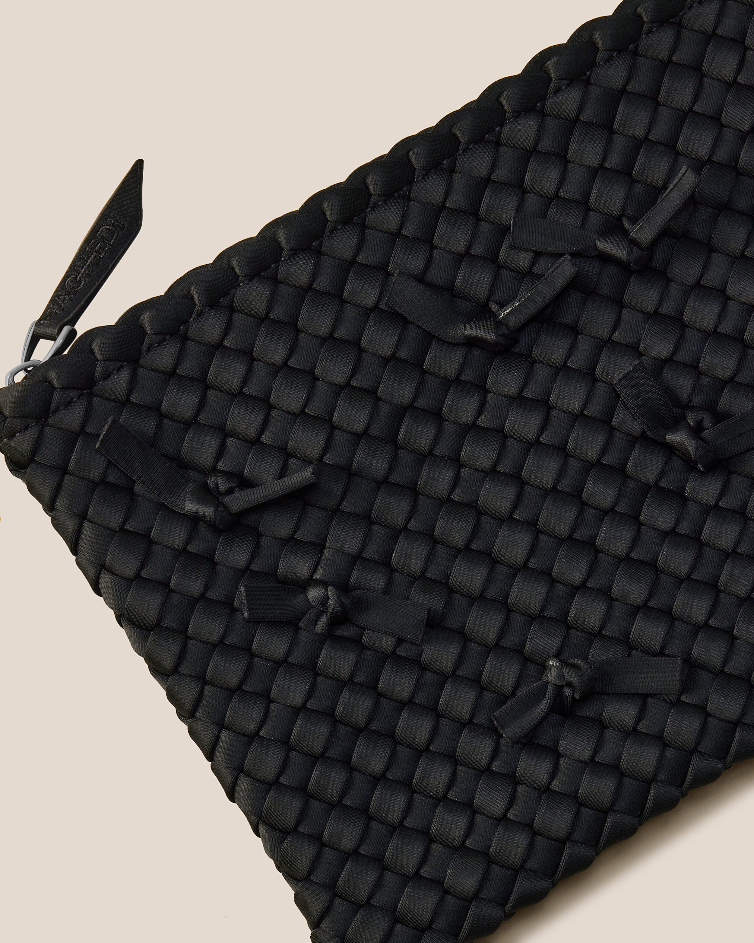 Close-up of included matching woven zippered pouch.