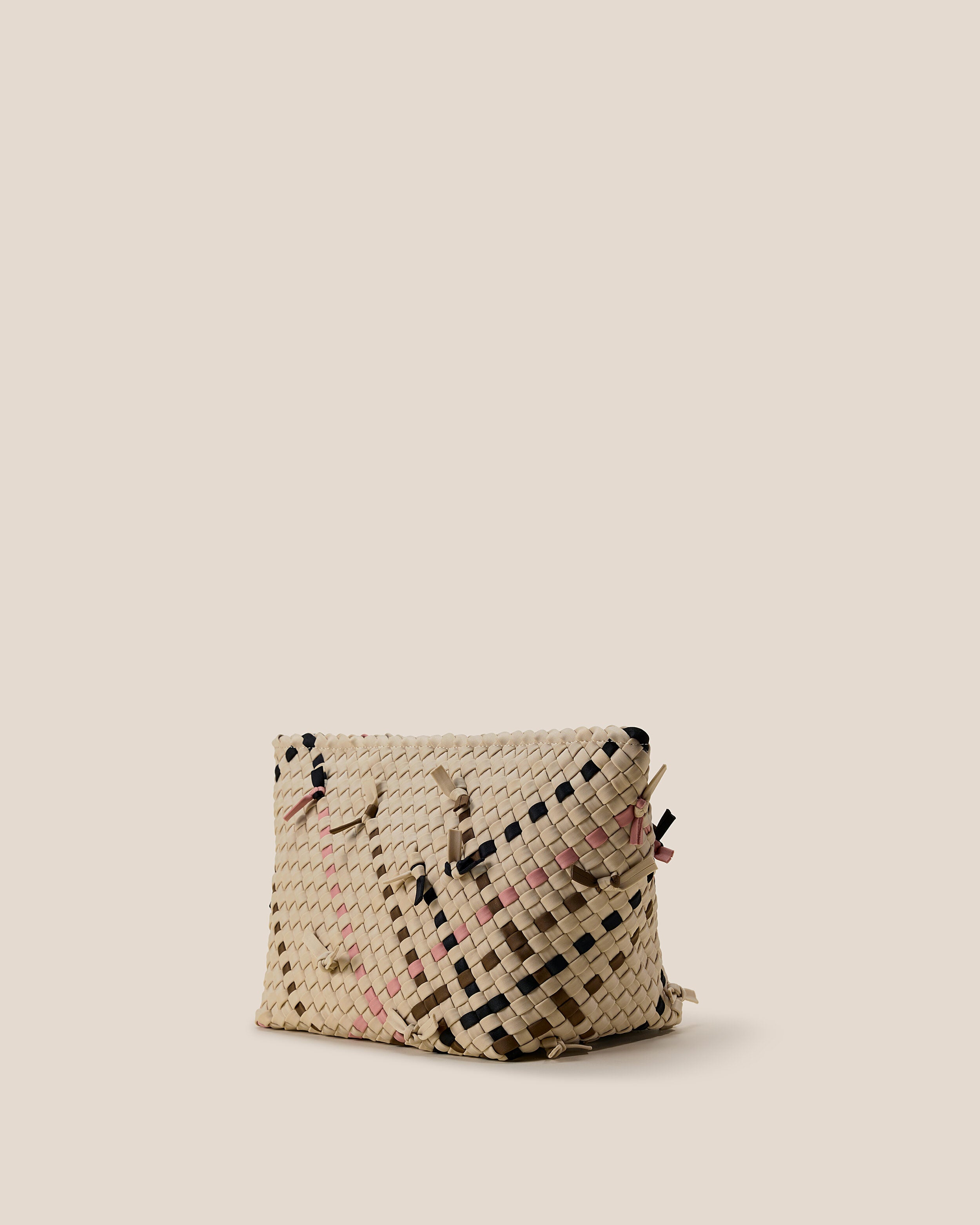 Portofino Cosmetic Pouch in Quartz shown from a side angle, highlighting its handwoven neoprene construction and zip closure.