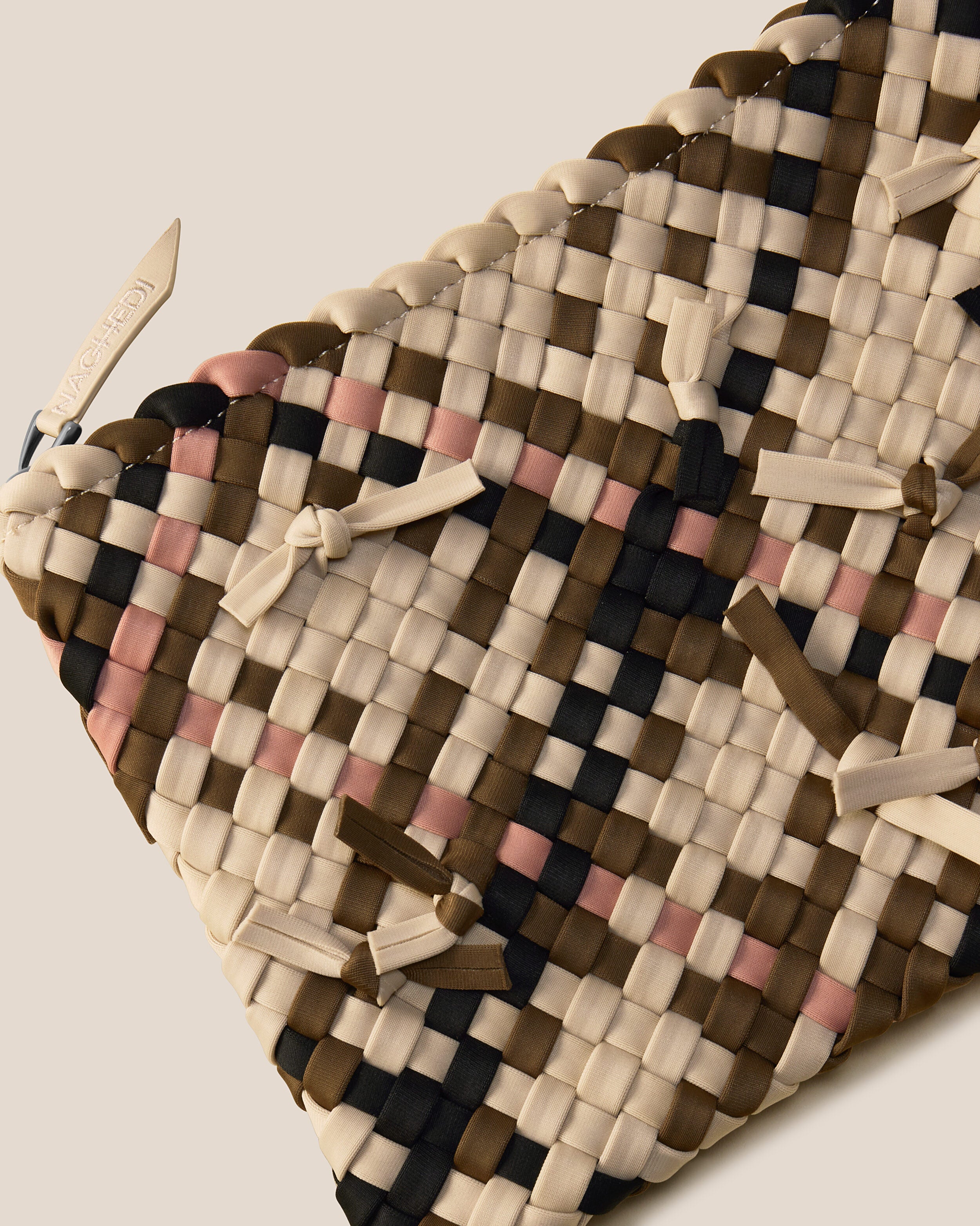 Close-up of included matching woven zippered pouch.