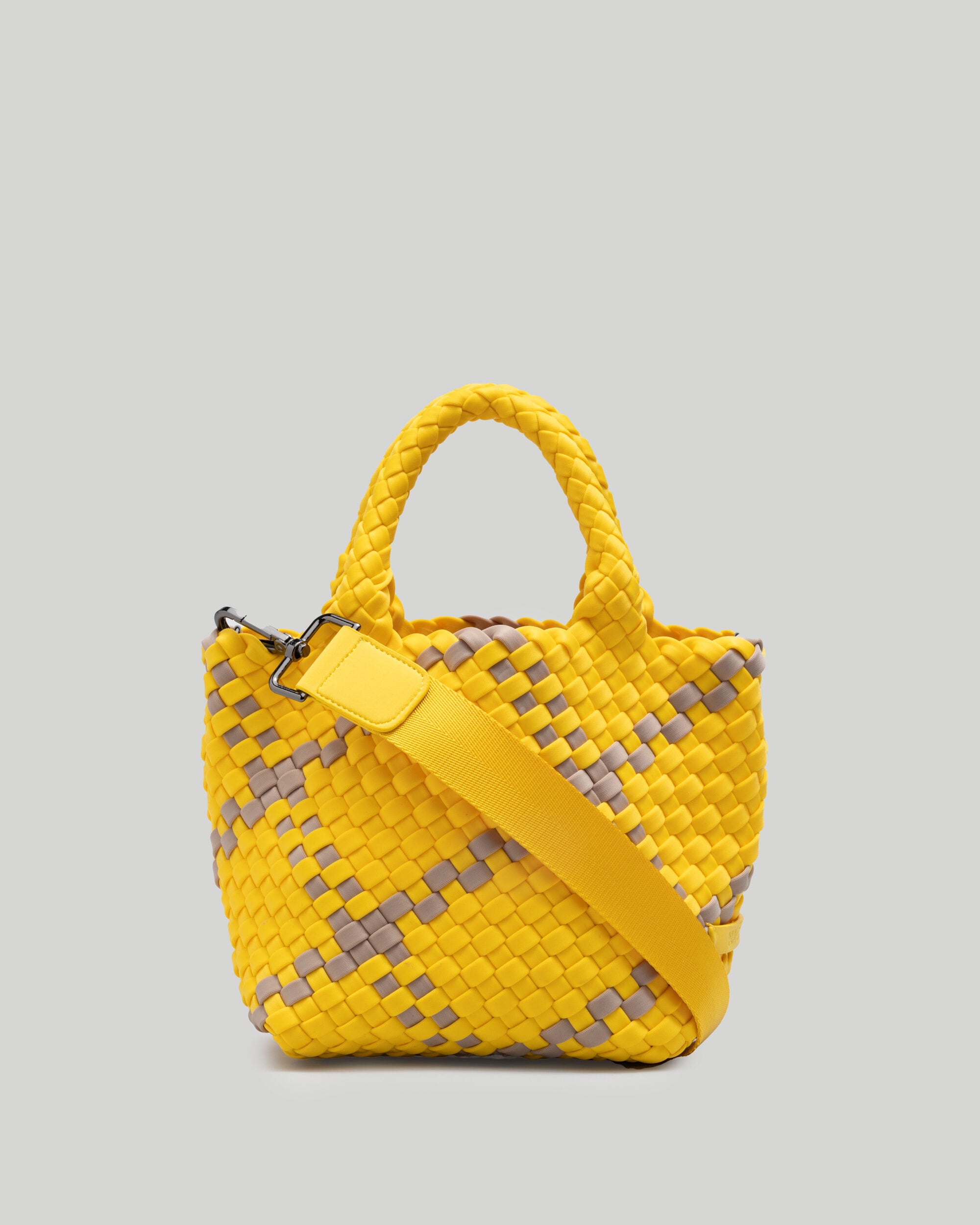 St. Barths Tote in Moorea in handwoven neoprene, featuring an open top, woven top handles, and detachable, adjustable nylon crossbody strap.