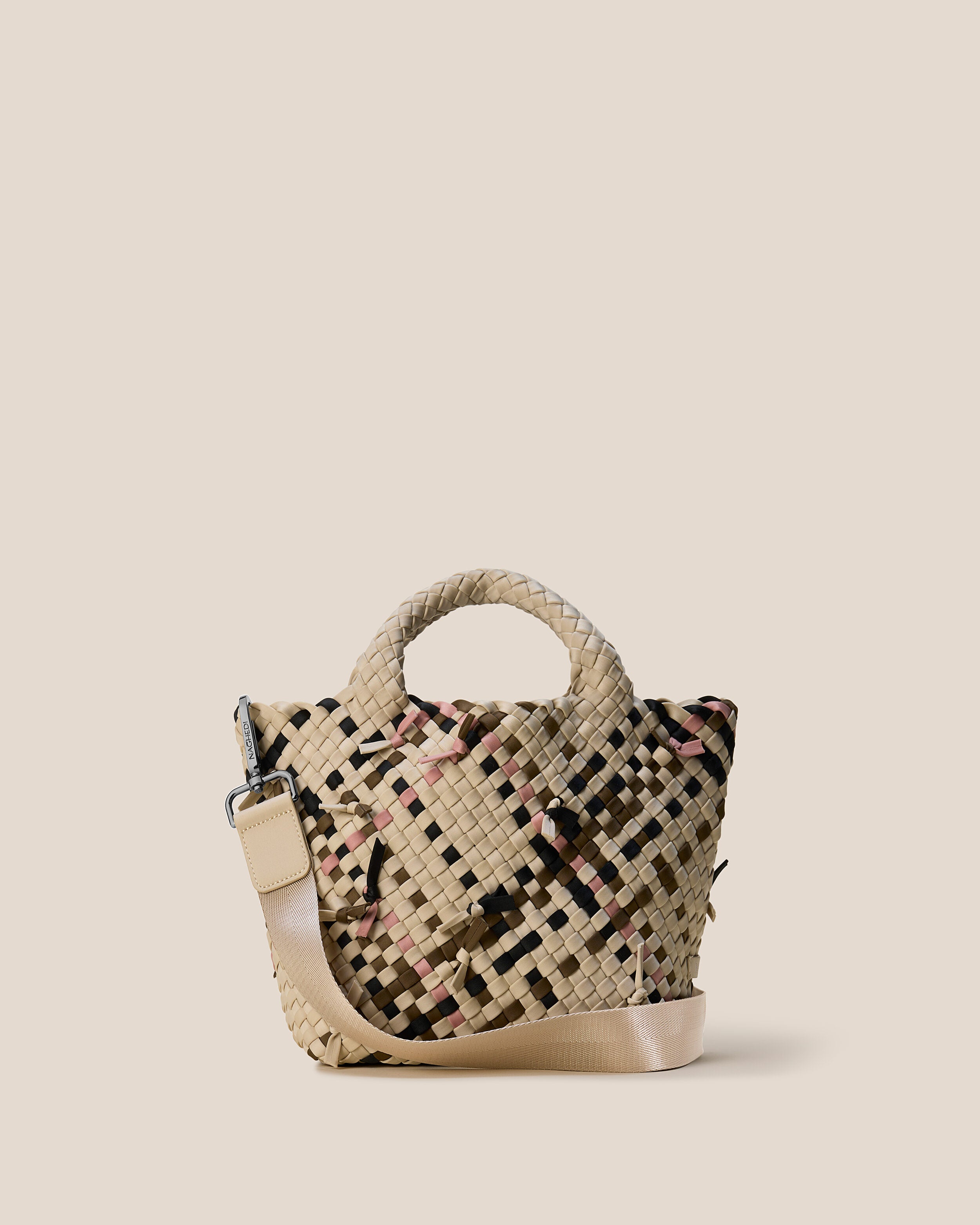 St. Barths Tote in Quartz, a cream tone with multicolor knot detail, in handwoven neoprene, featuring an open top, woven top handles, and detachable, adjustable nylon crossbody strap.