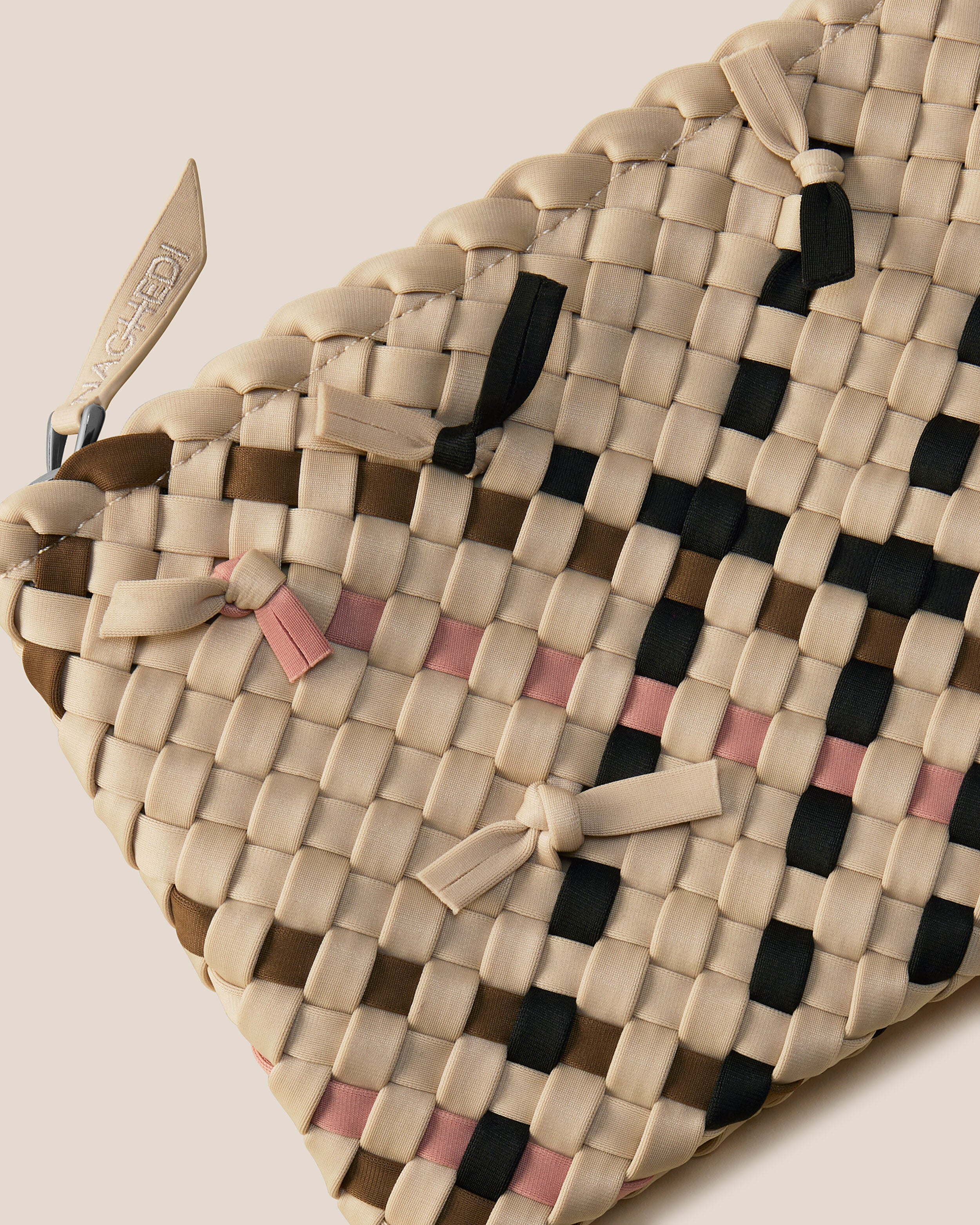 Close-up of included matching woven zippered pouch.