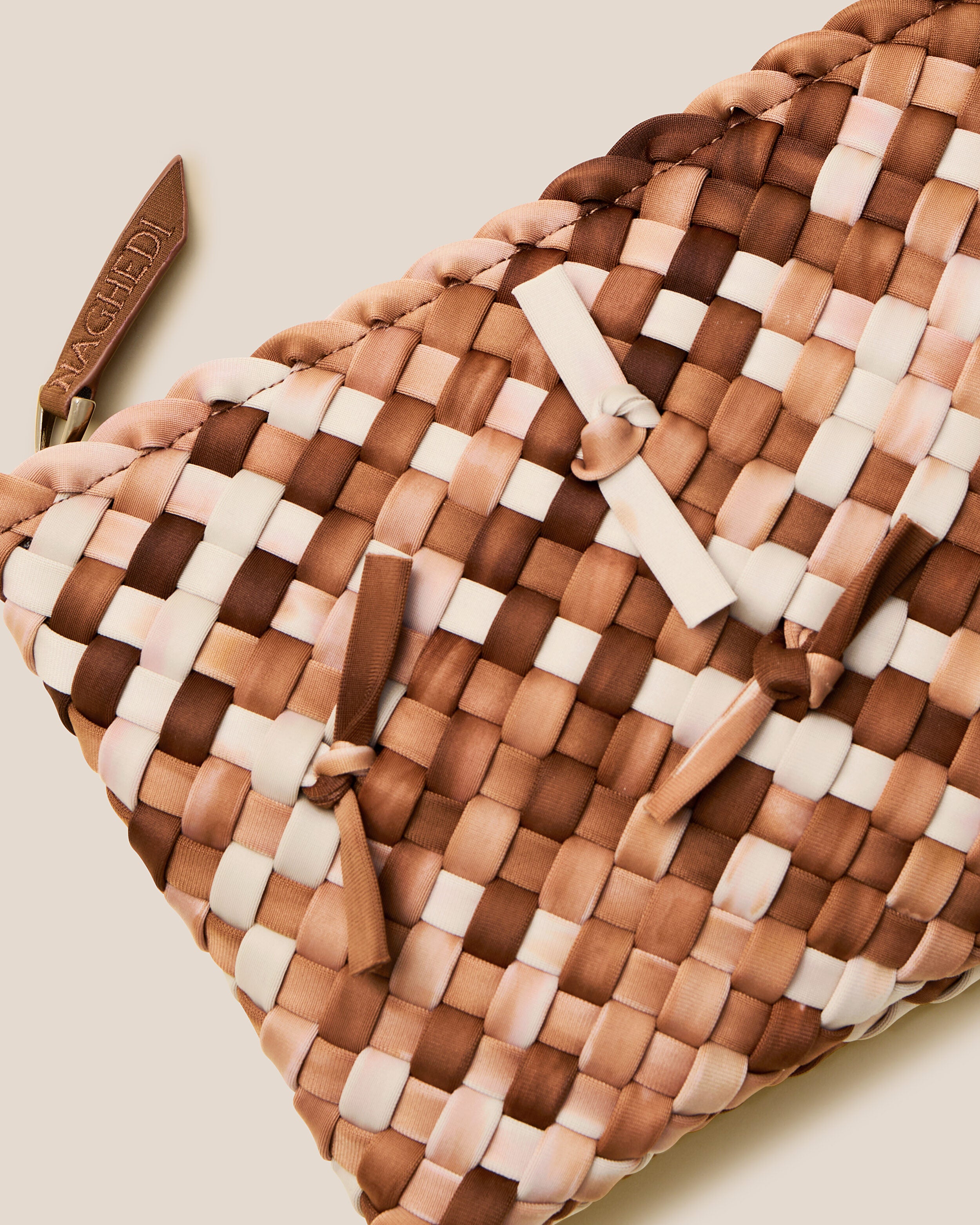 Close-up of included matching woven zippered pouch.