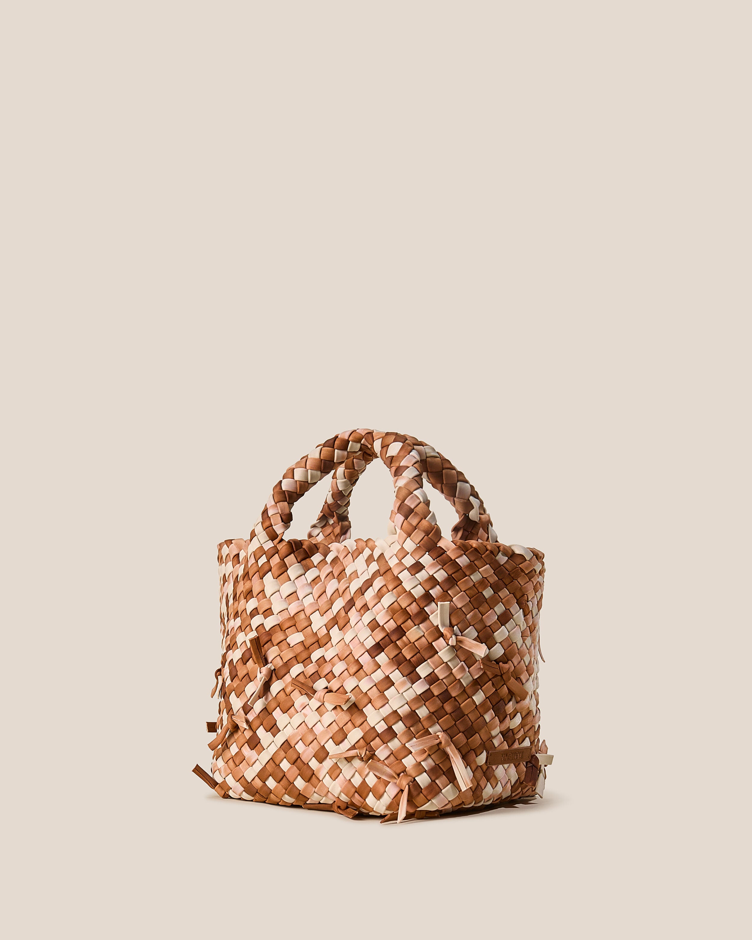 St. Barths Tote in Fawn shown from a side angle, highlighting its handwoven neoprene construction and open top.