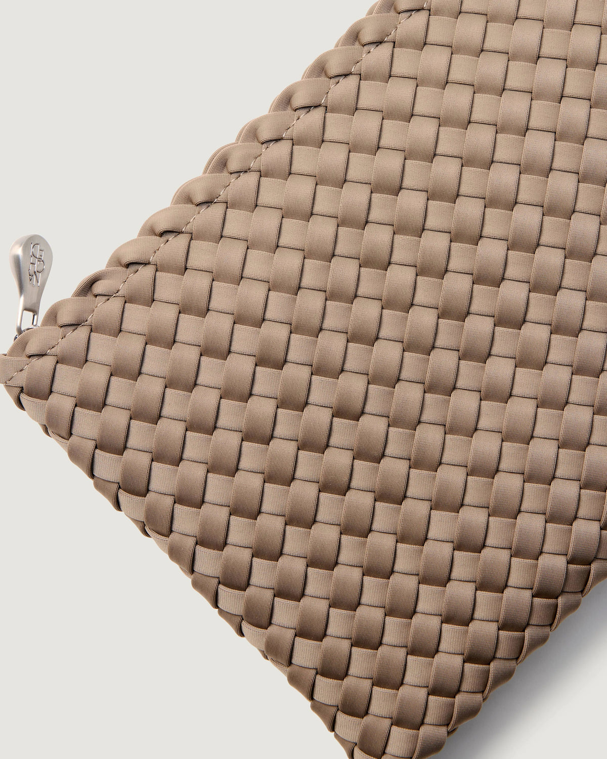 Close-up of included matching woven zippered pouch.